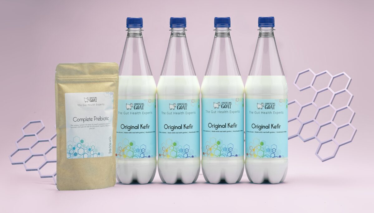 Image of Chuckling Goat's synbiotic, made up of goat's milk kefir and Complete Prebiotic powder. Pink background.