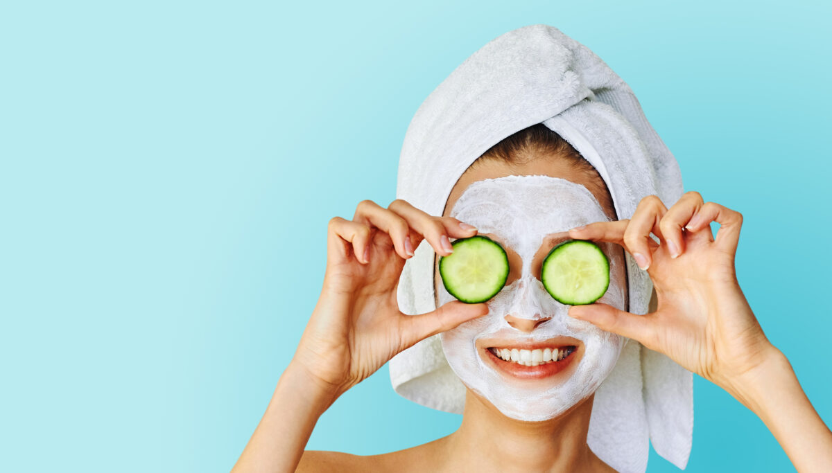 Skin care and treatment, spa and cosmetology concept. Over blue background with copy space